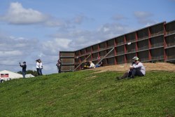 Families gather on the spectator hill to watch their drivers.