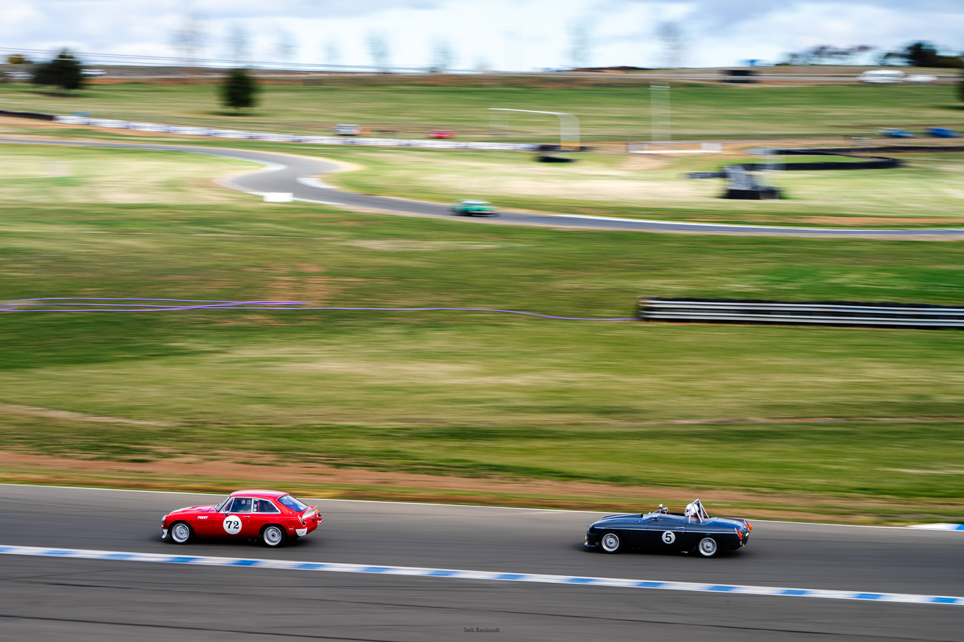 Steve Perry and Bruce Condron heading around turn two and up the hill